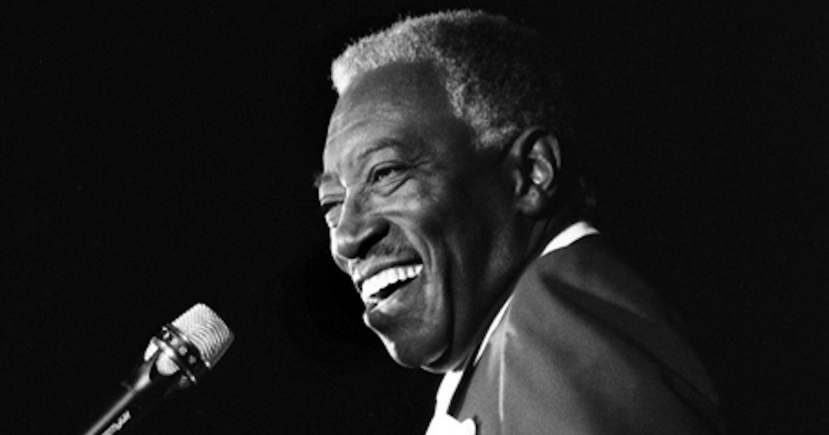 Joe Williams smiling on stage